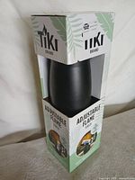 Front view of boxed TIKI adjustable flame torch