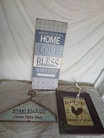 Group shot of all three wall signs displayed together