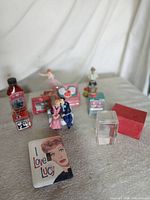 Group shot showing bottle, ornaments, switch cover, crystal block and other pieces