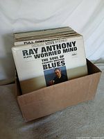 Box of LPs front view showing Ray Anthony sleeve