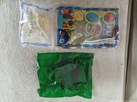 Both sealed toy bags on surface