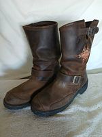 Full view of both boots angled right, showing overall condition