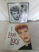 Both I Love Lucy tin signs front view