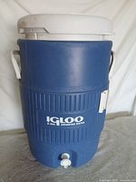 Front view showing Igloo logo, spigot, and handles