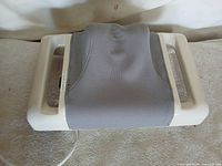 Top view of Sun Ancon Chi Machine showing grey fabric cradle and side handles