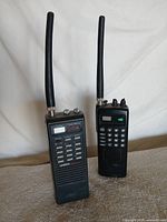 Front view of both Uniden scanners with antennas attached