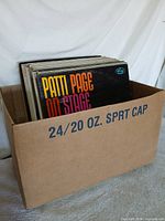 Box of vinyl records with Patti Page On Stage visible
