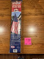 Front of sealed package showing United States Flag Kit with image of flag and contents list