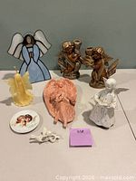 All eight angel-themed items displayed on tabletop