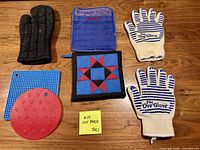 All seven heat-protection kitchen items laid out on table