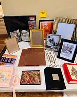All items in lot: assorted frames, albums, binder, backing boards, easel stands