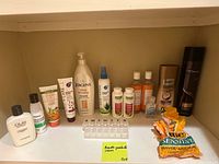 Shelf view showing all toiletries, razors, vitamins, pill organizer