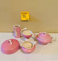 Full 5-piece ceramic tea set arranged on table showing all components