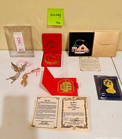 Overall view of all ornaments with boxes and certificates on table