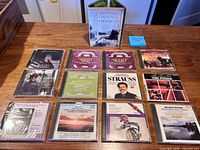 Overview of 12 jewel-case classical CDs and Classical Escape boxed set on tabletop