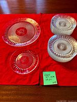 Two plates displayed plus stacked plates showing design and quantity