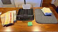 Dish rack with tray, mat and towels displayed on countertop