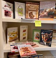 Books arranged on two shelves showing titles and condition