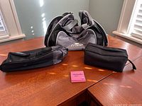 Main duffel bag and two accessory pouches on table