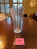 Front view of clear ribbed crystal vase on table