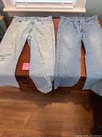 Front view of both pairs showing overall appearance, color and distressing on left pair