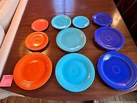 Front view of 10 Fiesta plates showing colours and sizes