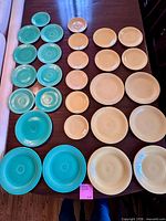 Front view of 28 Fiesta plates arranged by size and colour