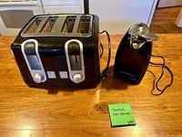 Front view of Hamilton Beach 4-slice toaster and matching electric can opener showing design, color and power cords
