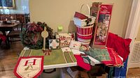 Overall lot showing tree box, wreath, baskets, pillows, linens, stocking, sign