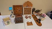 All items laid out showing variety of wooden décor pieces and vase