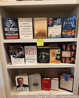 Front view of bookshelf with all 15 books displayed