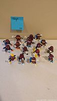 Group shot of all seventeen California Raisins PVC figurines on tabletop