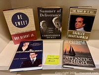 Five hardcover memoir books arranged on a table, front covers visible