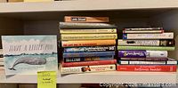 Shelf view showing all 20 humor/comedy books with identifiable spines