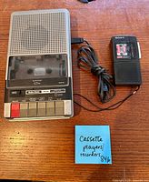 RadioShack tabletop cassette recorder, Sony handheld recorder, power cord attached, cassette tape inside Sony unit