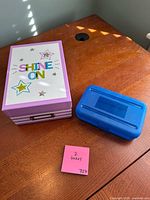 Two storage boxes closed on table