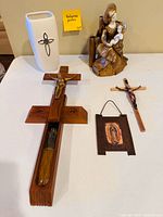All five religious decor items arranged on table