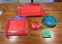 All four glass containers without lids, showing shapes and glass condition