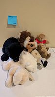 Group shot showing all eight plush animals