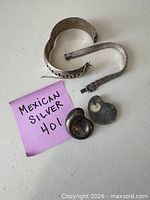 Group shot showing cuff bracelet, broken chain bracelet, two swirl pieces with note Mexican Silver 401