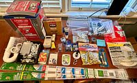 Full lot overview on tabletop showing all packaged items