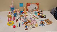 Overhead view of entire mixed toy lot laid out on table