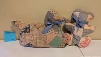 Front view of quilted patchwork duck and teddy bear plush toys