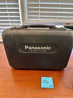 Closed black Panasonic OmniMovie hard case front view