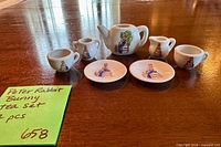 Full view of seven-piece porcelain Peter Rabbit miniature tea set