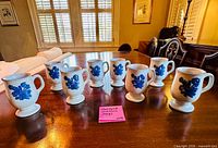 Front view showing all eight Yorktowne mugs on table