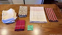 All grouped cloth napkins and tea towels on tabletop