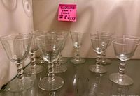 All ten clear glass Candlewick-style stemware glasses on shelf