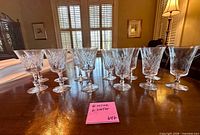 Front view of 12 cut crystal goblets arranged on table