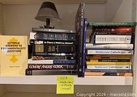 Front view two stacks of approximately 25 spirituality books on shelf showing spines and titles